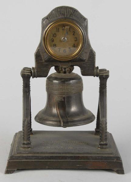 Brass Liberty Bell Clock. 
Description