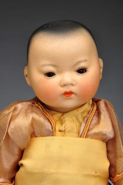 A.M. Asian Toddler Doll. 
Description