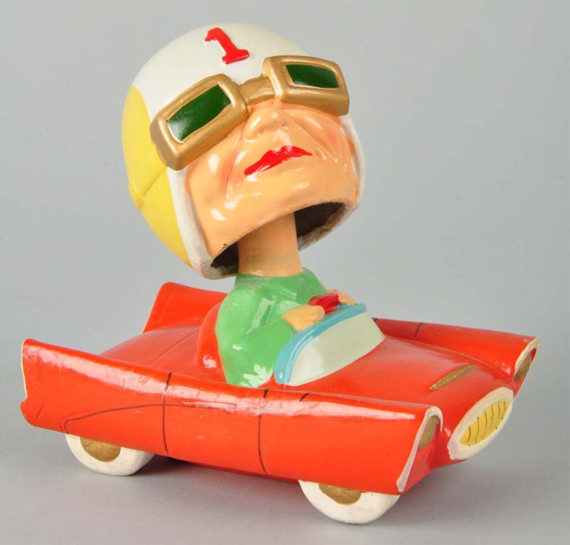 Race Car Driver Bobbing Head Doll. 
Description