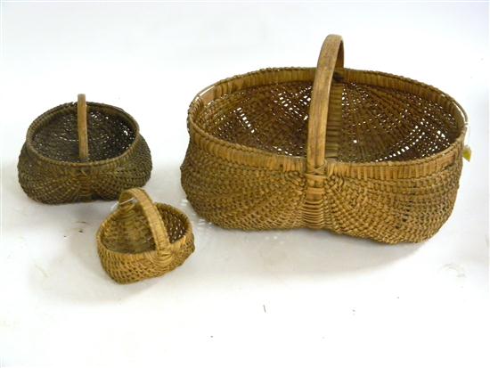 Three woven buttocks baskets with