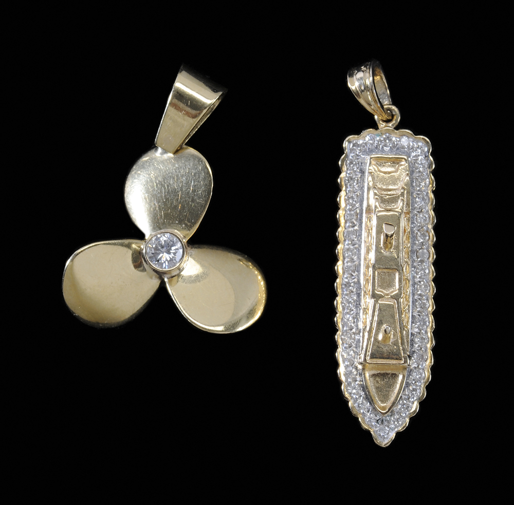 Two Gold Charms one 14 kt. cruise