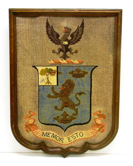 Beadwork coat of arms  framed.