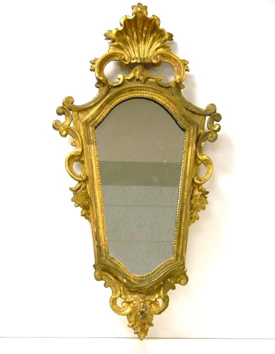 Gilt wall mirror with shell finial