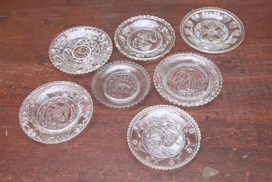 SEVEN LACY GLASS CUP PLATES. Includes