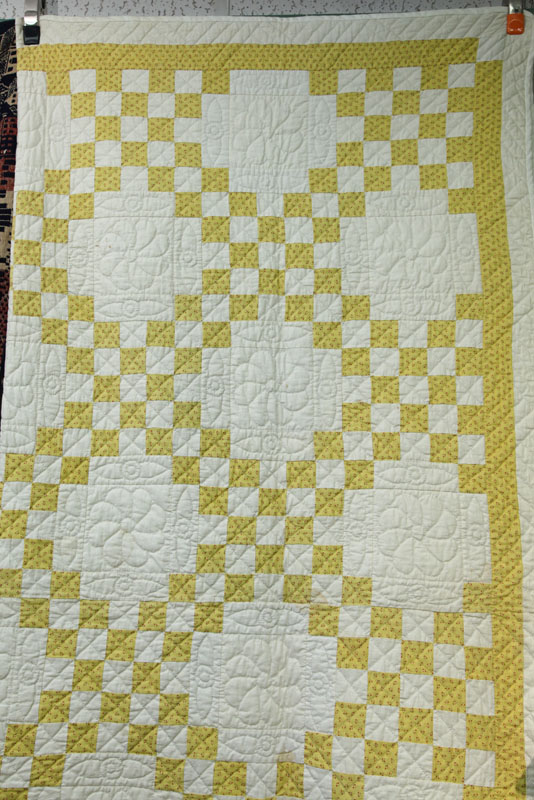 QUILT. White ground with yellow