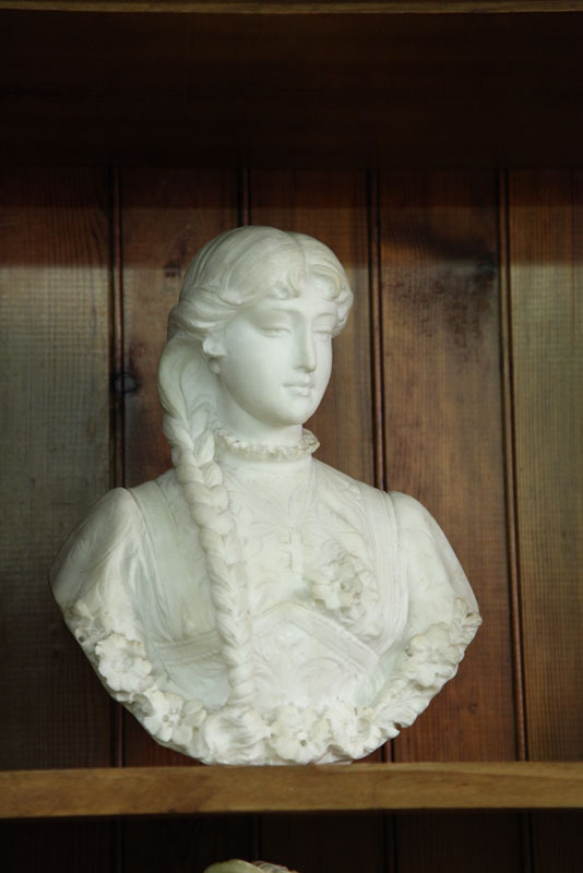MARBLE BUST. Classical woman with braided