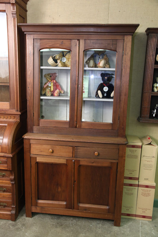 STEPBACK CUPBOARD. Walnut with