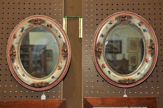 PAIR OF OVAL MIRRORS. Floral decorated