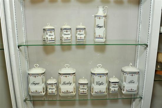 ELEVEN PANTRY CANISTERS. Gilt and