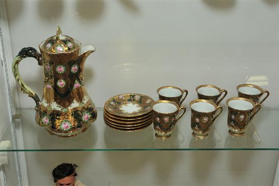 SEVEN PIECE CHINA CHOCOLATE SET. Unattributed.