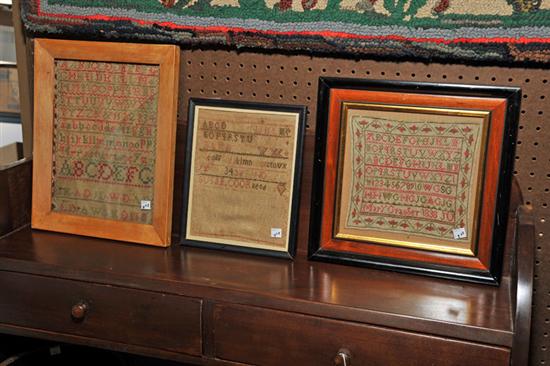 THREE FRAMED SAMPLERS Red and 114fa8