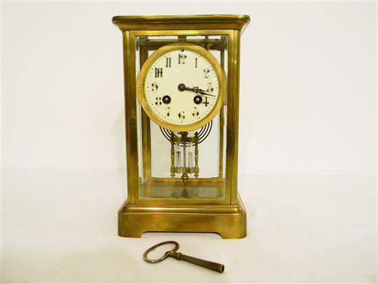 Brass and glass mantel clock with mercury