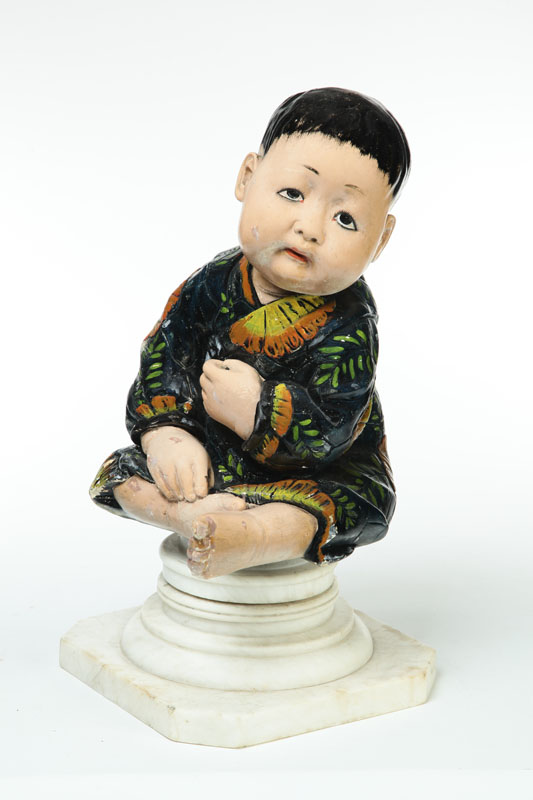 FIGURE OF A CHILD ON PEDESTAL.