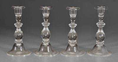 Set of four Steuben candlesticks: clear
