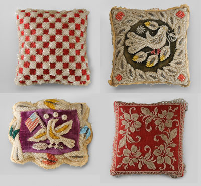 Four beadwork pincushion pillows: one