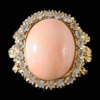 Coral, diamond ring, central cabochon-cut