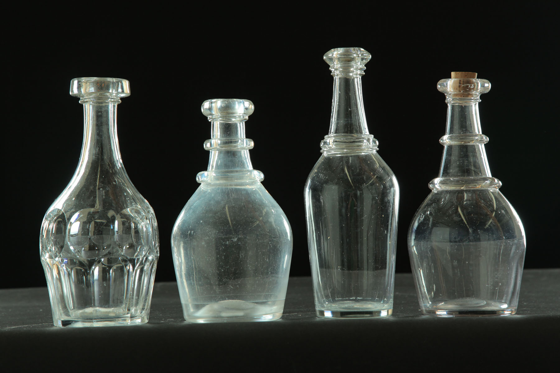 FOUR BAR BOTTLES.  American  mid 19th