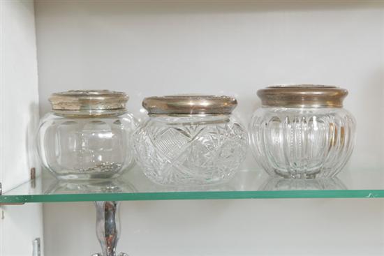 THREE GLASS DRESSER JARS WITH STERLING