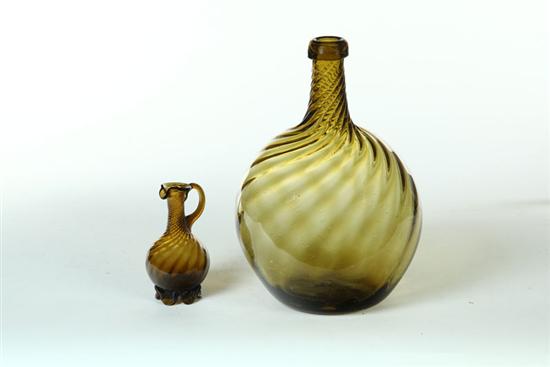 TWO PIECES OF BLOWN AMBER GLASS.