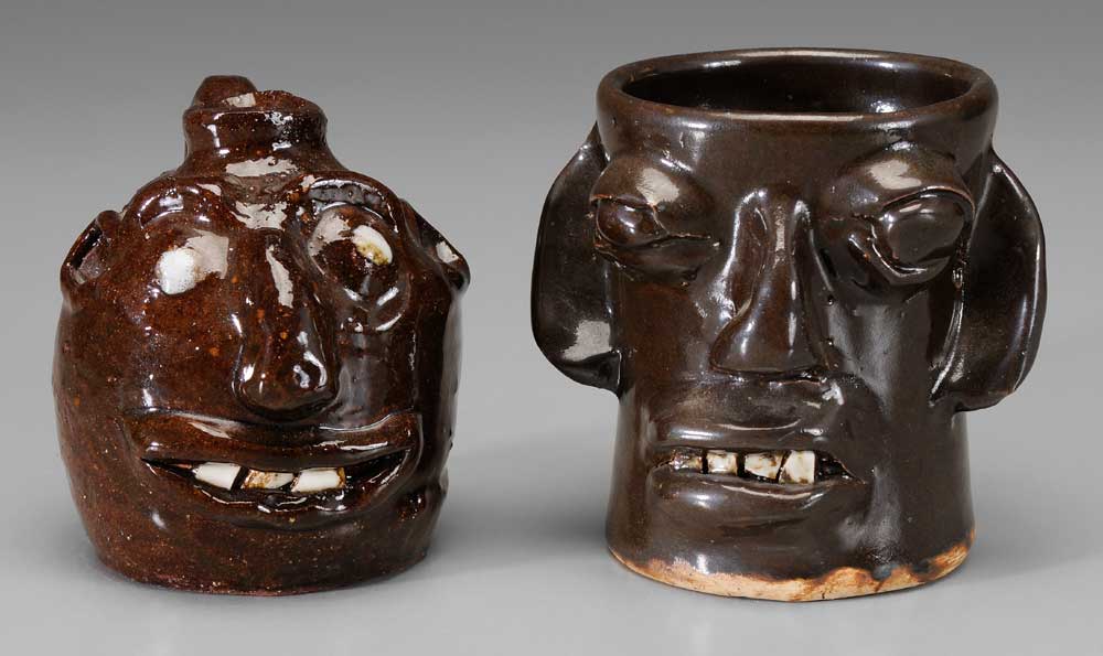 Two Pottery Face Vessels mid to