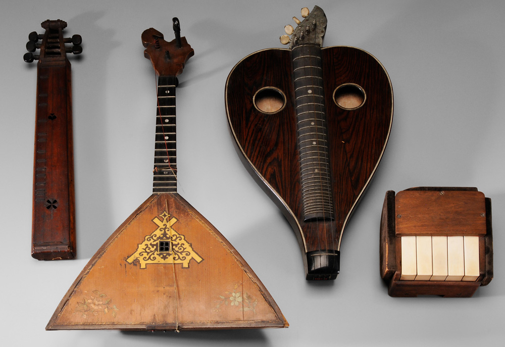 Group of Four Antique Musical Instruments