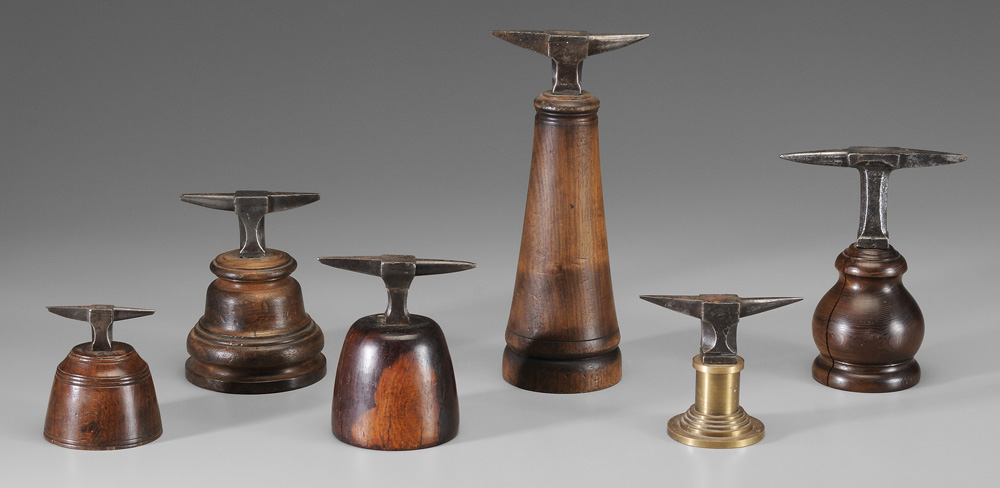 Six Jeweler Anvils all with wooden bas