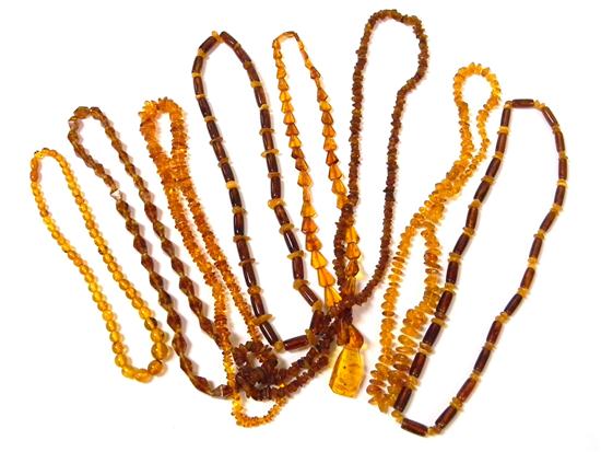 JEWELRY Eight amber necklaces 12118e