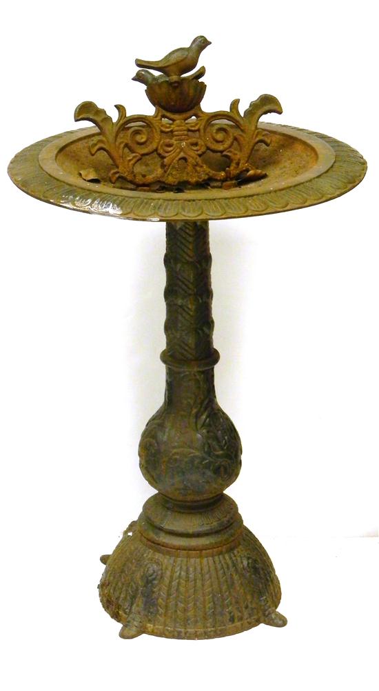 Cast-iron birdbath on shaped pedestal