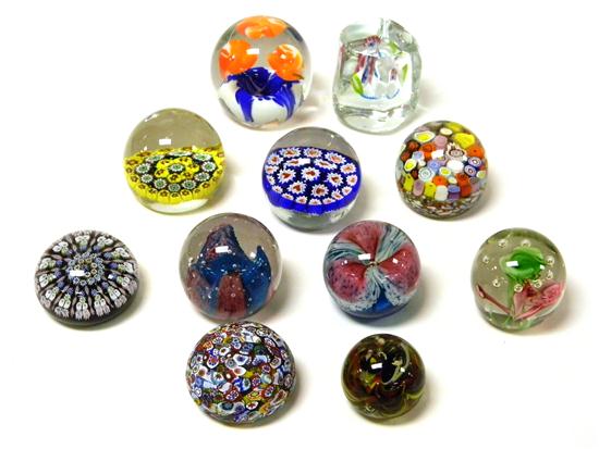 Eleven paperweights including: