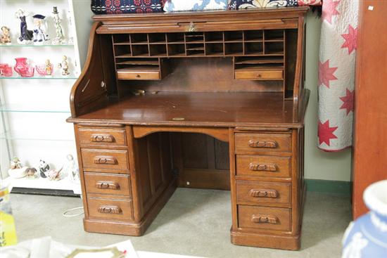 ROLL TOP DESK. Oak and of typical form