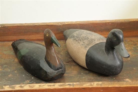 TWO DUCK DECOYS One carved and 121352