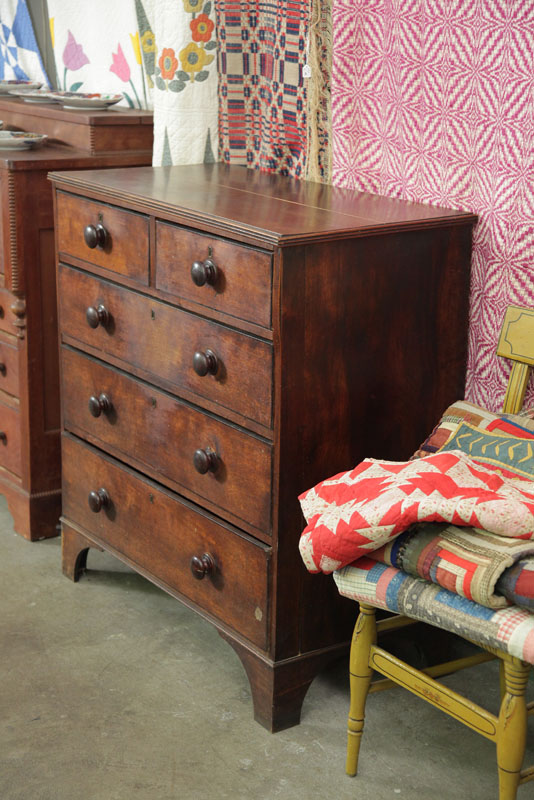 CHEST OF DRAWERS. Walnut having