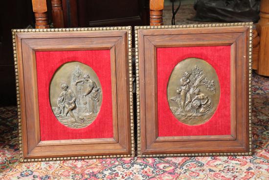 TWO FRAMED PLAQUES. Bronze plaques with