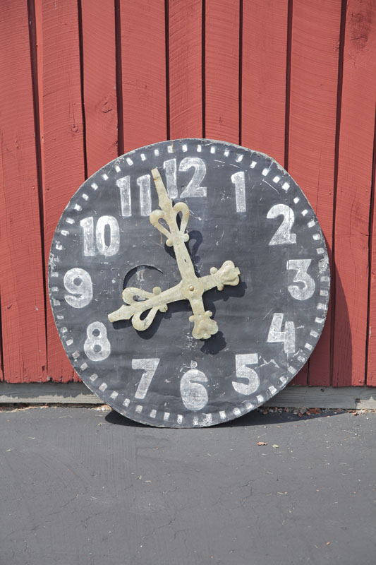 FOLKSY CLOCK FACE WITH MOVABLE HANDS.