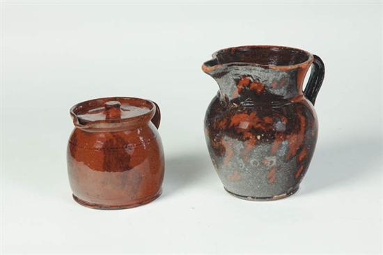 TWO REDWARE PITCHERS.  American  mid