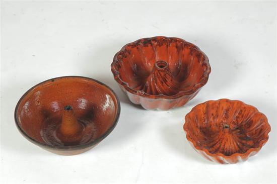 THREE REDWARE FOOD MOLDS.  American