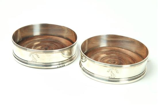 PAIR OF ENGLISH SILVER WINE COASTERS.