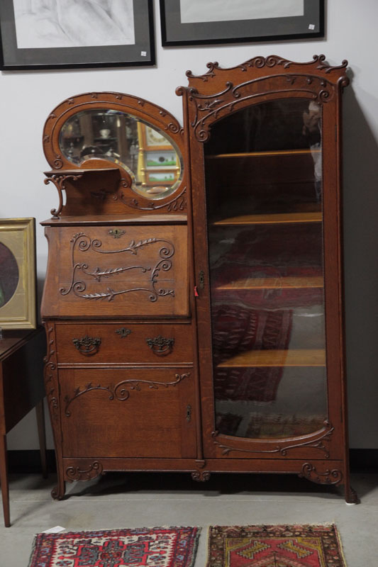 SIDE BY SIDE BOOKCASE. Oak having a