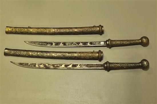 TWO DHA SWORDS. Inlaid blades  and metal