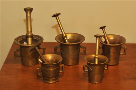 FIVE BRASS MORTARS AND PESTLES. American