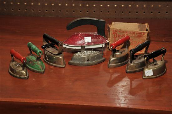 EIGHT MINIATURE SAD IRONS. American