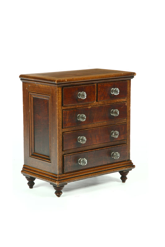 DECORATED MINIATURE CHEST OF DRAWERS.