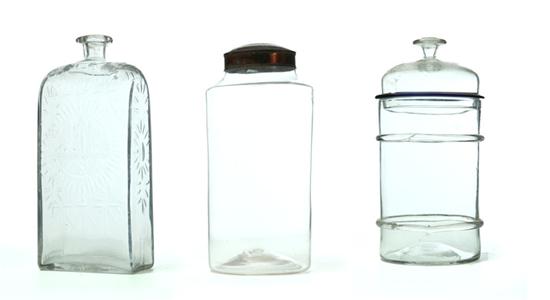 CASE BOTTLE AND TWO GLASS CANISTERS.