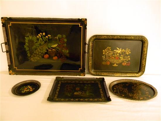 Five tole ware trays: three oblong;