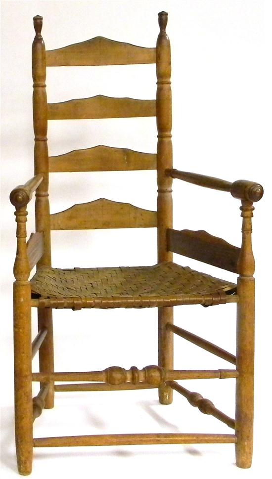 Ladderback arm chair  caned seat  turned