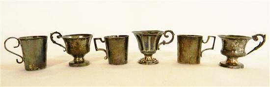 Group of six miniature cups  two pairs