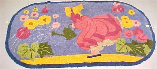 20th C. oval hooked rug with sunbonnet