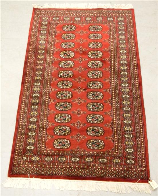 Bokhara pattern rug with red field