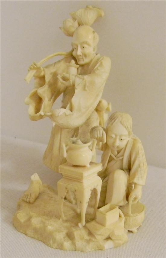 Man and boy on ivory base with stove