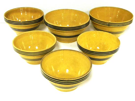 Six yellow ware blue striped bowls 